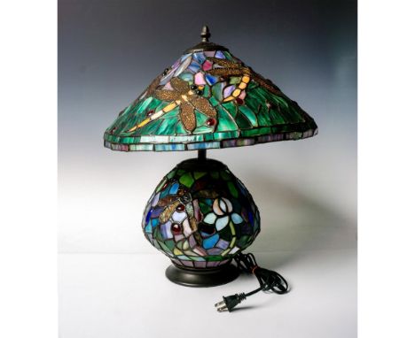 The colored glass and cabochons with the dragonfly motif make this a stunning and unique addition to any room. Colored in gre
