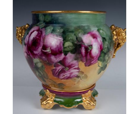 Hand painted in dark green background with lovely flowers in cream, peach and purple and gilt accents on elephant head handle