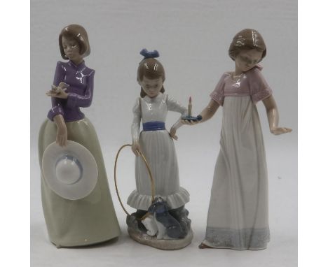 Three boxed Nao figurines, largest H: 27 cm. UK P&amp;P Group 2 (£20+VAT for the first lot and £4+VAT for subsequent lots)