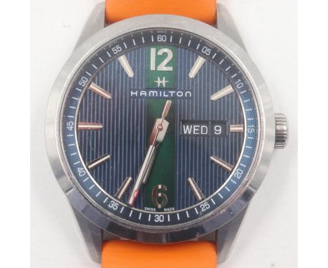 HAMILTON: gents steel cased wristwatch, with baton and Arabic chapters against a two-tone blue and green dial with day and da