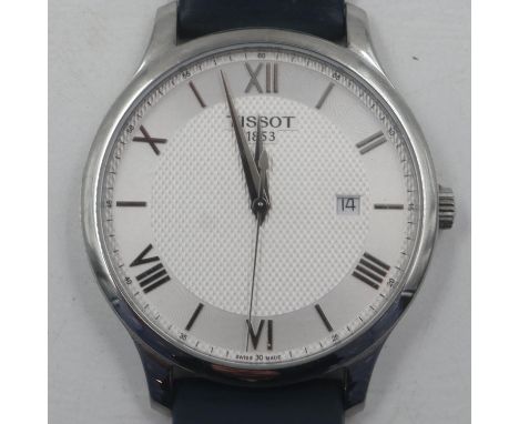 TISSOT 1853: gents steel cased wristwatch, Roman chapters against a textured steel dial with date aperture, on blue leather s