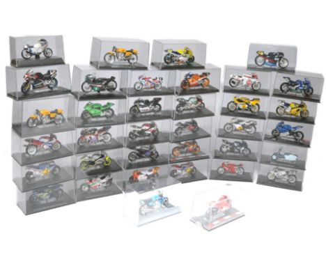 A group of 36 diecast 1/24 model motorcycles in display cases as shown. All look to be secure and generally good or better. 