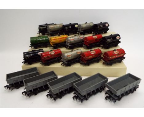 Fifteen Hornby 00 fuel tankers and five Wrenn hopper wagons 