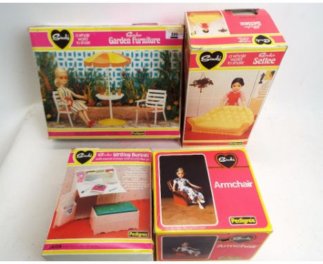 Four boxed vintage Sindy, 1970's furniture, armchair, writing bureau, settee and garden furniture 