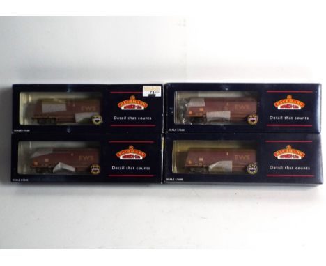Four 00 gauge Bachmann 104 tonne EWS weathered wagons 