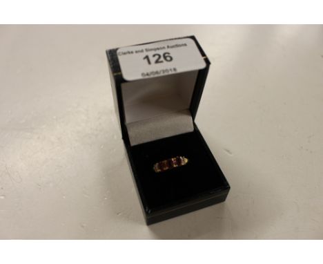 A silver gilt diamond and ruby set ring