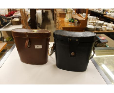 A pair of Dolland of London binoculars and a pair of USSR binoculars