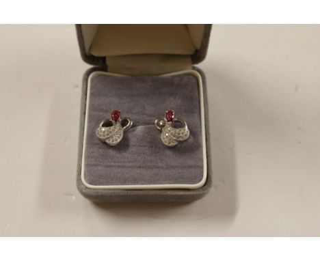 A pair of silver and ruby set ear-rings
