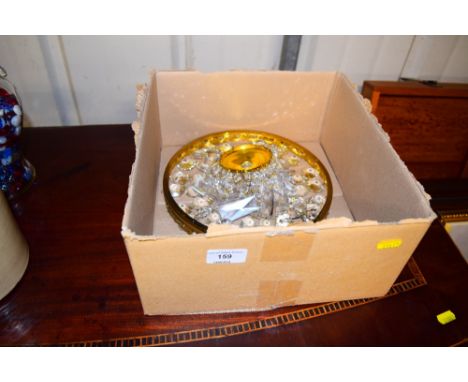 A brass and glass light fitting 