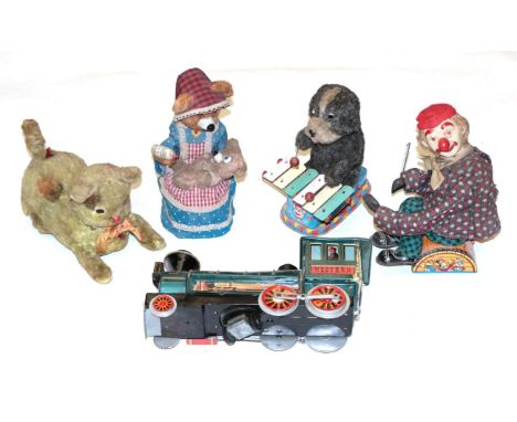 Various Battery Toys including Violin playing clown with celluloid face (lacks violin), Bear bottle feeding baby, Xylophone p