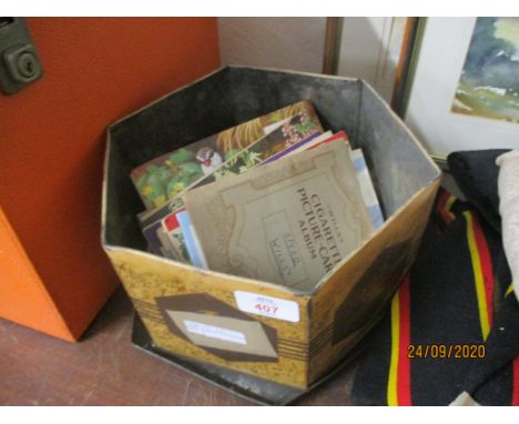 TIN CONTAINING VARIOUS CIGARETTE CARDS AND BROOKE BOND COLLECTORS CATALOGUES