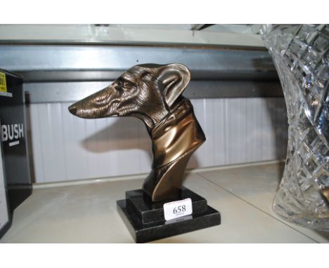 A bronzed dogs head raised on step base (10)