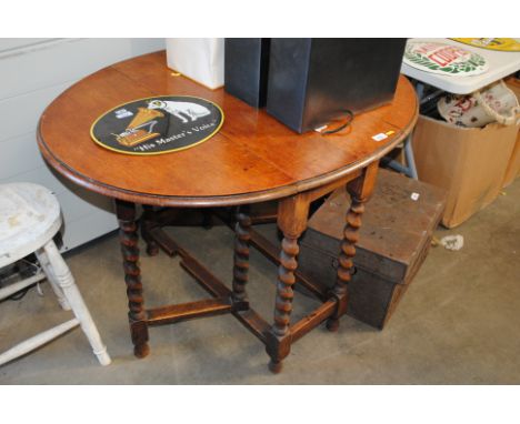 An oak barley twist gate leg table 