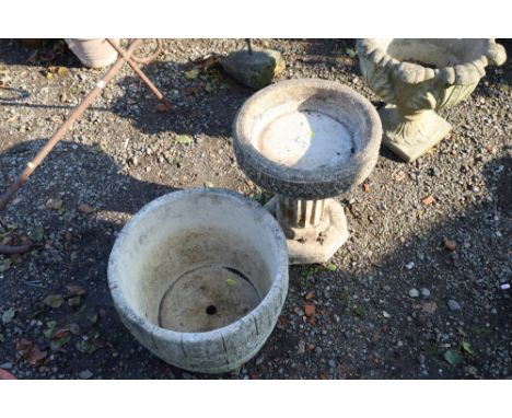 A Cotswold Company concrete planter in the form of a half barrel together with a bird bath