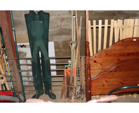 A quantity of various long handled gardening tools