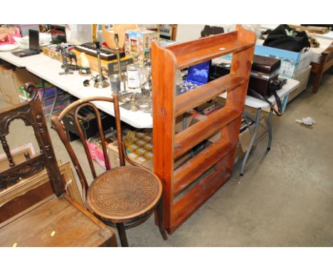 An open pine shelf and a Thonet style bentwood chair