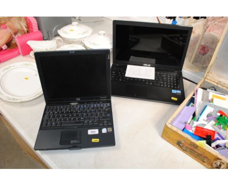An Asus laptop and an HP Compact NC4400 laptop