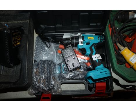 A cordless screwdriver with charger and attachments 