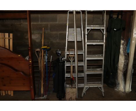 An aluminium step ladder and a quantity of long handled gardening tools