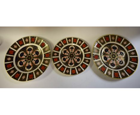 A pair of Royal Crown Derby 1128 pattern plates, 27cm diameter; another, 23cm, all first quality (3)