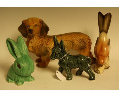 Ceramics - a Sylvac rabbit; a large model of a dog; a similar donkey; a thrush (4)