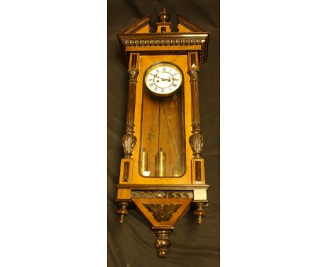 A Vienna type wall clock, the case with broken arch pediment centred by an urnular finial, 14cm dial, 105cm high overall