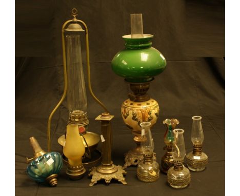 A Famos hanging parafin lamp; an oil lamp, ceramic font; others (8)