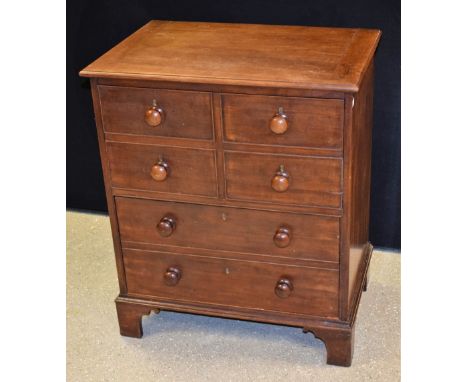 A '19th century' mahogany chest/commode, of small proportions, hinged rectangular top above a pair of deep long drawers, the 