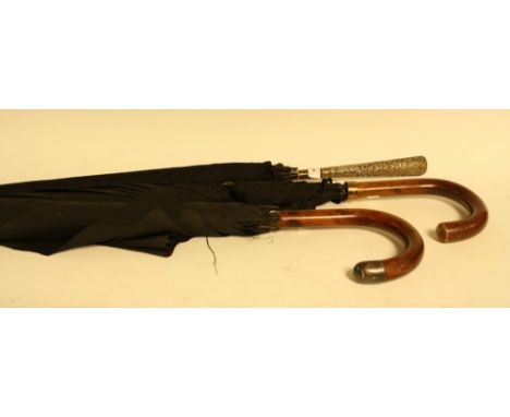 Vintage Fashions - A late 19th/ early 20th century umbrella;  a silver topped umbrella,  another similar (3)