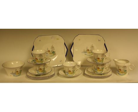 A Shelley Country Garden pattern part tea service, comprising five cups, saucers and side plates, a pair of bread and butter 