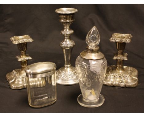 A pair of Edwardian silver boudoir candlesticks, hollow filled, 13cm high, Birmingham 1905, faults; a later single candlestic