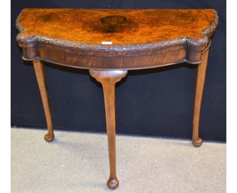 A Queen Anne Revival walnut card table, 93cm wide