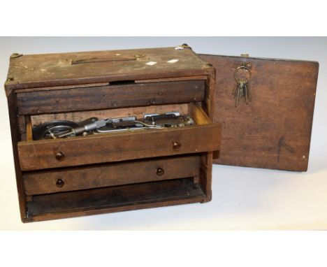 A mahogany engineer's chest, four internal drawers, key and lock containing a variety of engineering tools to include caliper