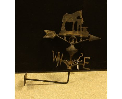 A reproduction cast metal wall mounted weather vane, as a horse