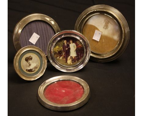 A George V silver circular easel photograph frame, Birmingham 1919; others, various dates and makers (5)