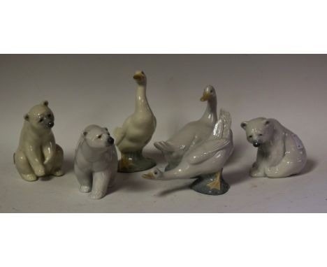 A Lladro polar bear, standing; others, seated and with raised paws; a Nao goose figure; others (6)