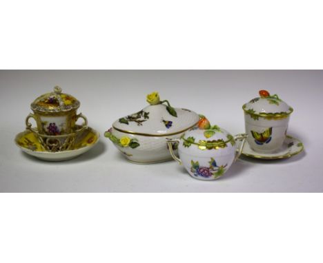 A Herend porcelain chocolate cup and cover; a similar sucrier; another; a Dresden chocolate cup and stand (4)