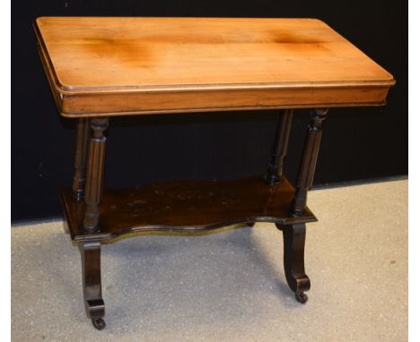 A late Victorian mahogany centre table, rounded rectangular top above a cockbeaded frieze, fluted spreading cylindrical suppo