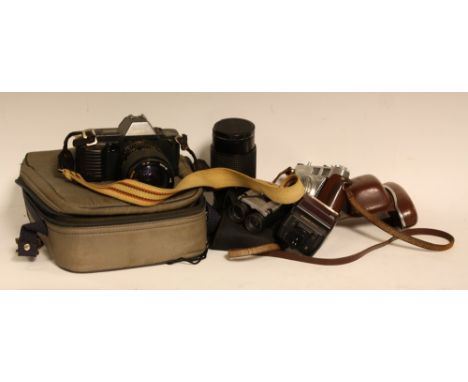 A Canon T70 SLR camers body, Tamron 28-70mm and Tokina 50-200mm lenses, flash etc;  a vintage Kodak Retinette 1A, Binocular e