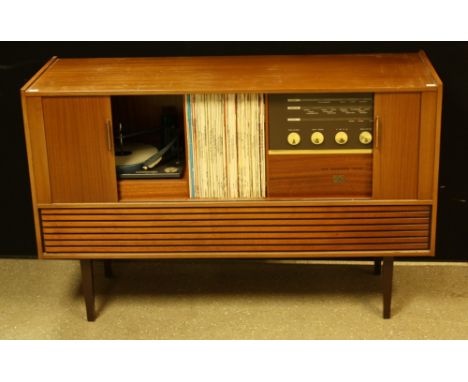 A retro mid-20th century His Master's Voice stereogram, model number 2302, 114.5cm wide; a quantity of vinyl records