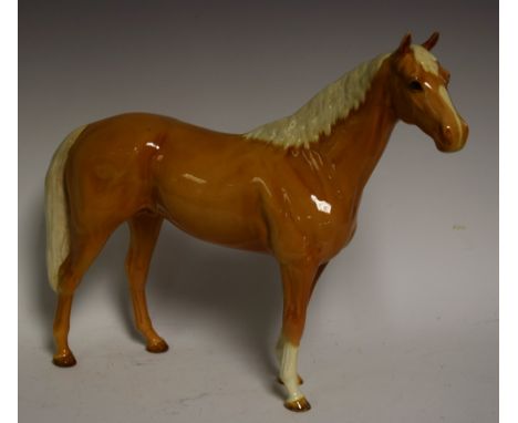 A large Beswick model of a Palomino horse, 29.5cm