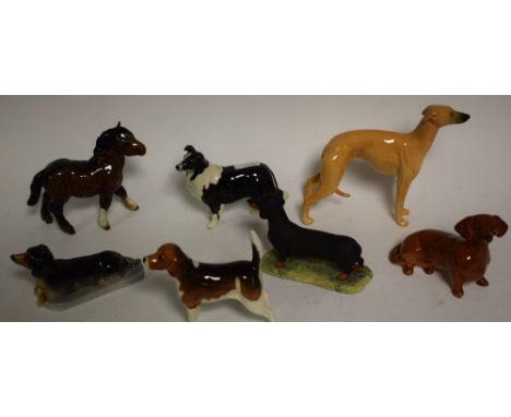 A Beswick model of a Fox Hound; others, Collie dog, Dachshund, Whippet; a Beswick pony foal; etc (7)