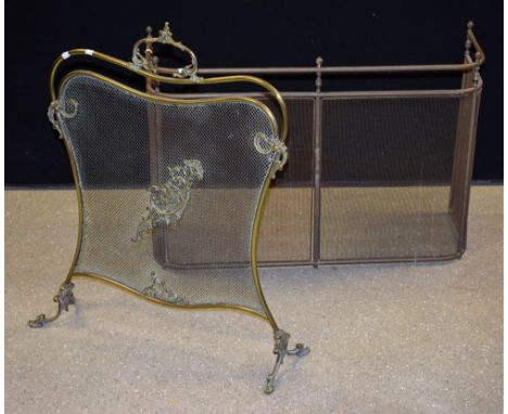 An Art Nouveau brass fire screen, c.1905; a 19th century brass nursery fender (2)