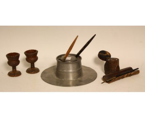 Boxes and Objects - a pair of carved treen thistle bowl egg cups; a treen tree trunk inkwell desk stand; dipping pens; pewter