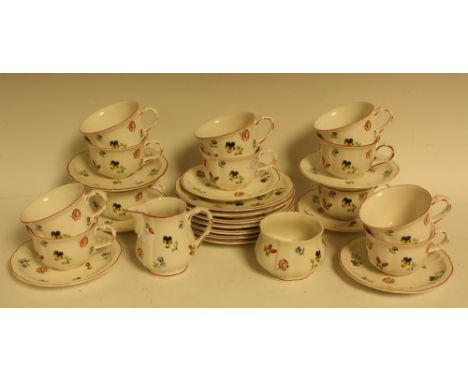 A Villeroy &amp; Boch part tea set comprising side plates, cream jug, sugar bowl, cups and saucers