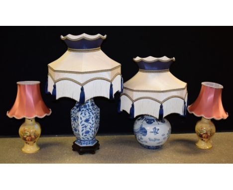 A Chinese inspired blue and white table lamp; another similar; a pair of Aynsley table lamps (4)