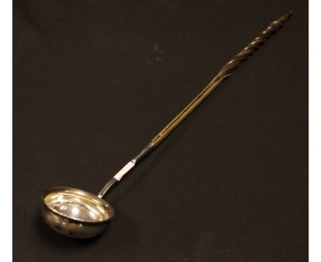 An unmarked white metal toddy ladle, possibly silver, 37cm long