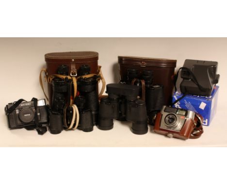 A pair of Hunter binoculars, 7 x 50, number 26835, LB168, brown leather case; a pair of NIL Bino Prism No5 MkV x 7 binoculars