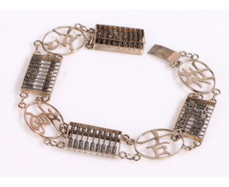 White metal bracelet with panels of Chinese characters and abacus, stamped 14k to the clasp, 19cm long weight 6.8 grams&nbsp;