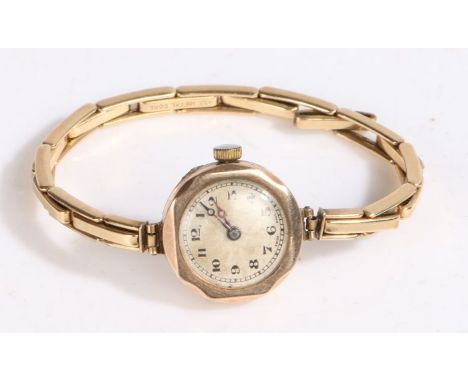 9 carat gold ladies wristwatch, the dial with Arabic numerals and outer minutes track, manual wound, the case 21mm wide, on a